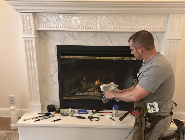 Ravenna Chimney Sweep performing fireplace maintenance in Ravenna, OH