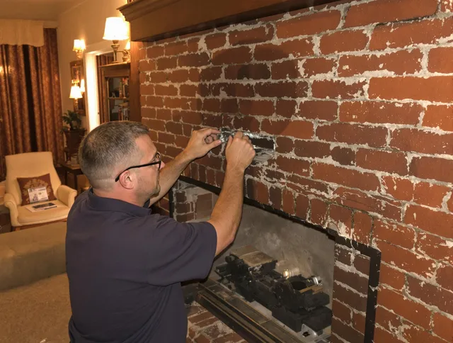 Ravenna Chimney Sweep expert fixing a fireplace in Ravenna, OH